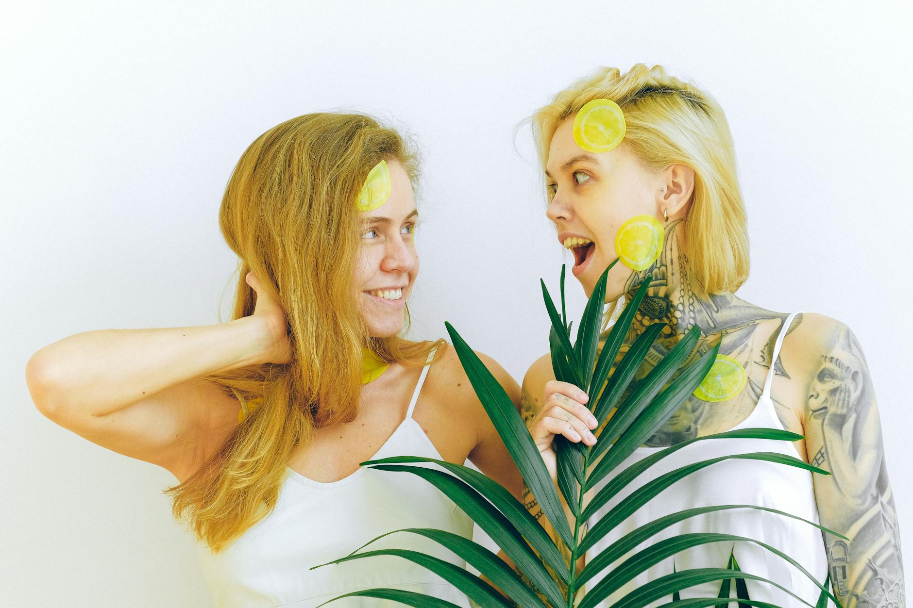 Woman holding a clitoral vibrator with thoughtful expression, representing reconnection with pleasure during menopause